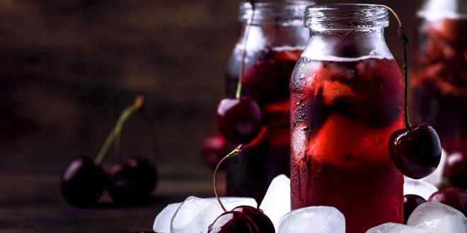 a glass of tart cherry juice and probiotic water